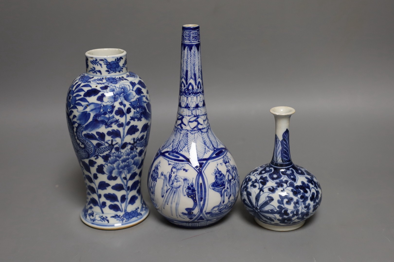 A Chinese blue and white ‘Dragon’ baluster vase and two blue and white bottle vases, 19th century and later, Tallest 21 cms.